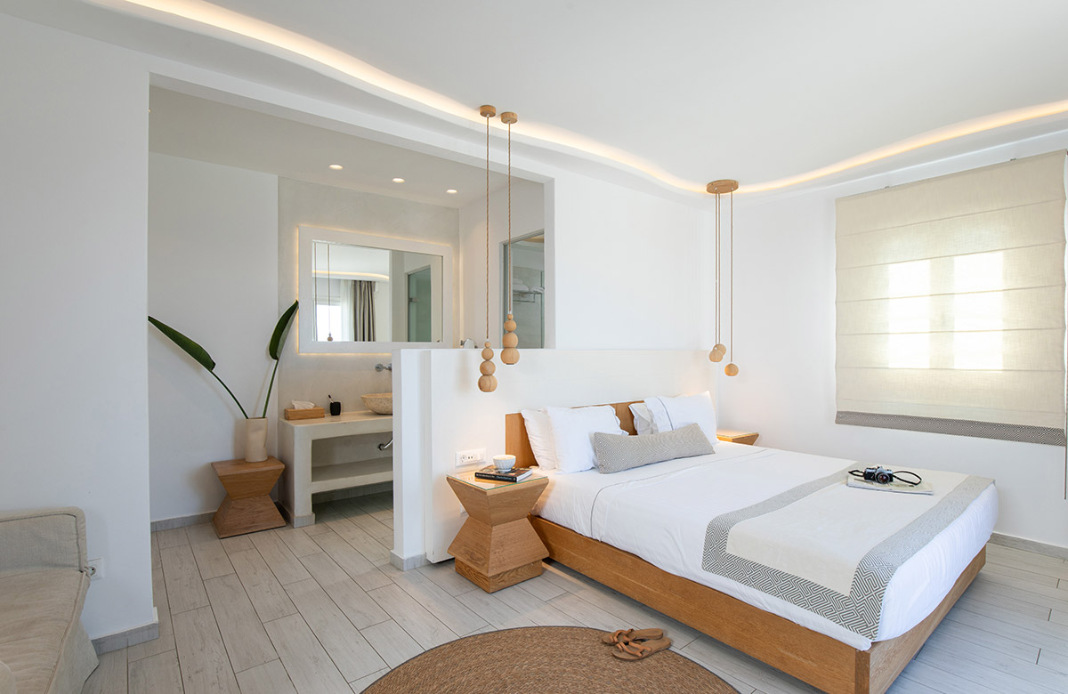 Deluxe hotel room in Mykonos Town with open air bathroom and minimal Cycladic interior design