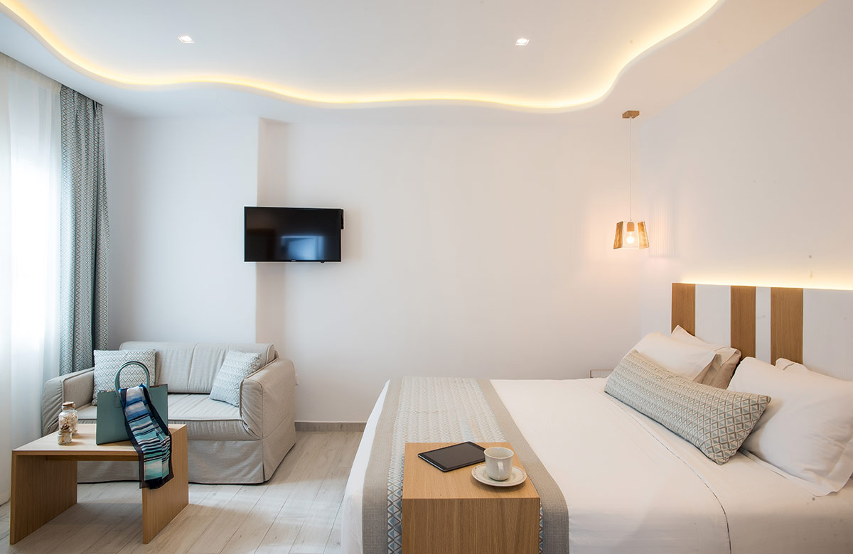 Classic Room with soft lounge corner and sleeping area at Damianos Hotel Mykonos Town