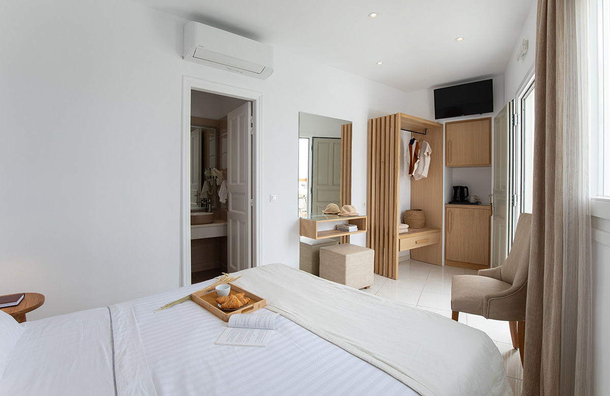 Cozy Small Room interior at Damianos Hotel Mykonos with smart layout and natural tones