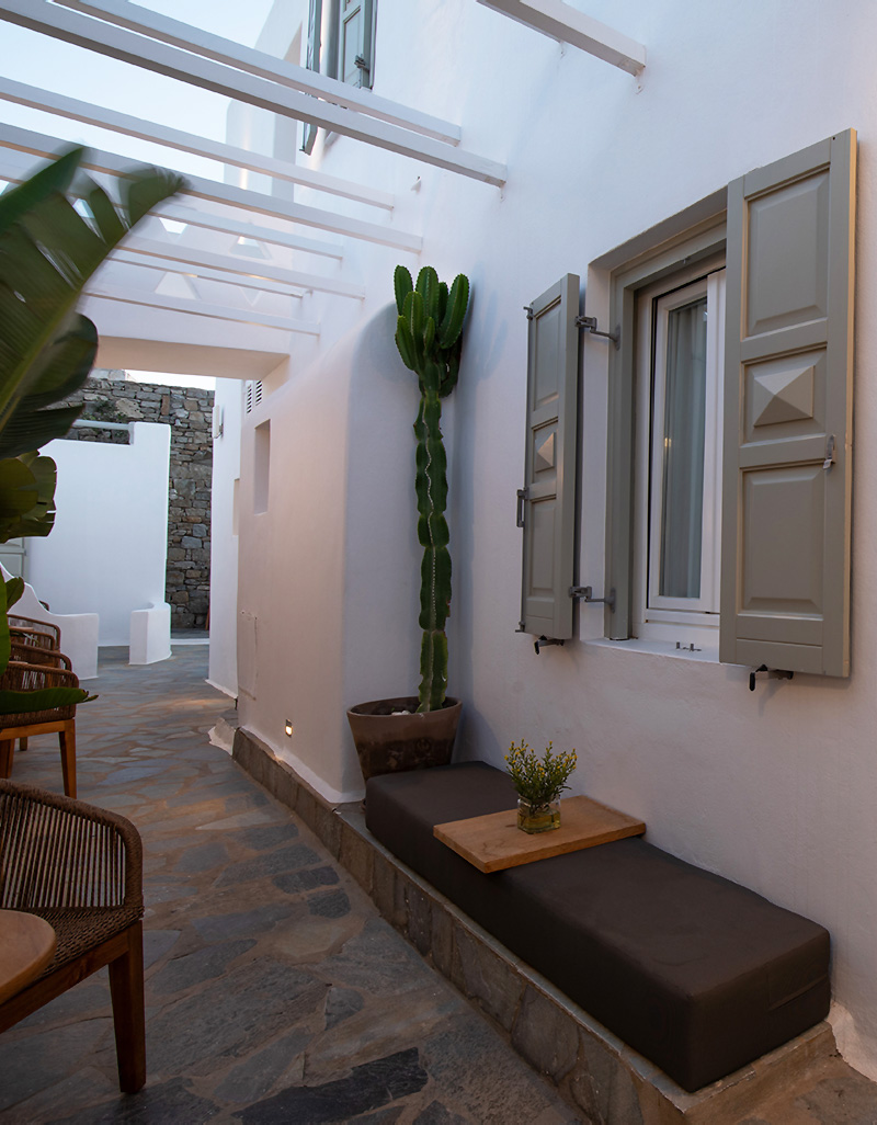 Outdoor patio area of a Cozy Small Room at Damianos Hotel Mykonos with Cycladic details
