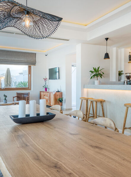 Lounge and bar interior at Damianos Hotel in Mykonos Town with shared seating areas