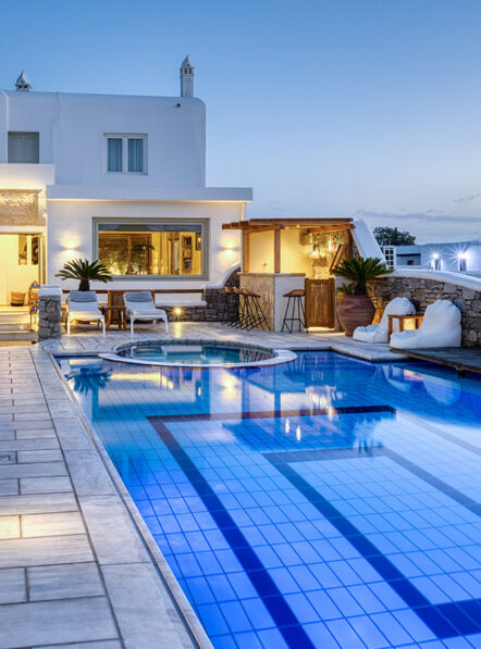 Outdoor swimming pool at Damianos Hotel in Mykonos Town during the evening hours